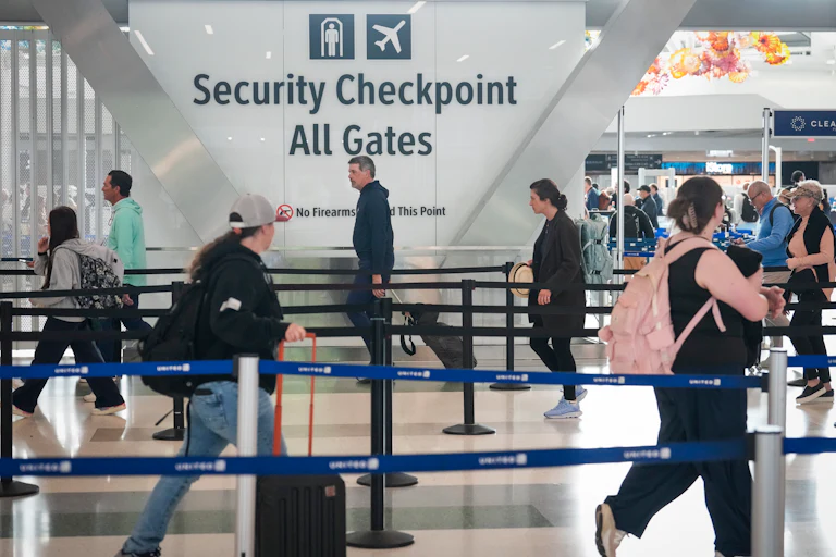 People walk in the TSA line at the George Bush Intercontinental Airport in Houston, Texas.