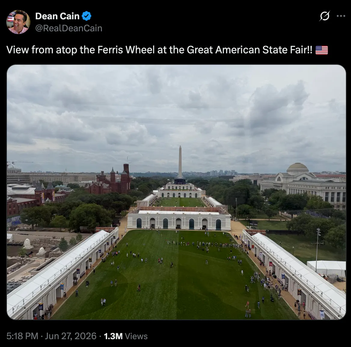 A tweet from Dean Cain reading "View from atop the Ferris Wheel at the Great American State Fair!! 🇺🇸" with a picture of the National Mall, with very few people present. 
