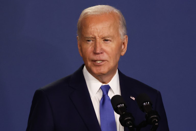 Joe Biden speaks into microphones