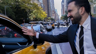 A photo of Zohran Mamdani shaking hands with a taxi driver