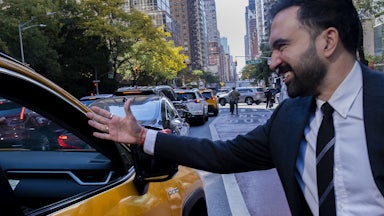 A photo of Zohran Mamdani shaking hands with a taxi driver