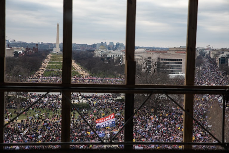 looking out a window you see a huge crowd of "Stop the Steal" protesters
