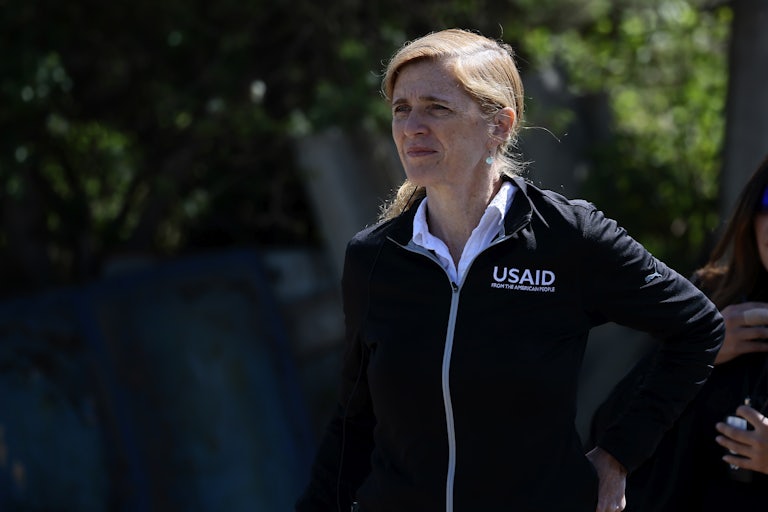 Samantha Power stands with her hand on her hip