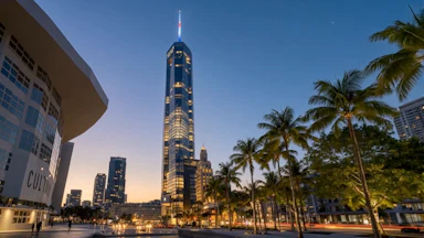 Rendering of a skyscraper near some palm trees.