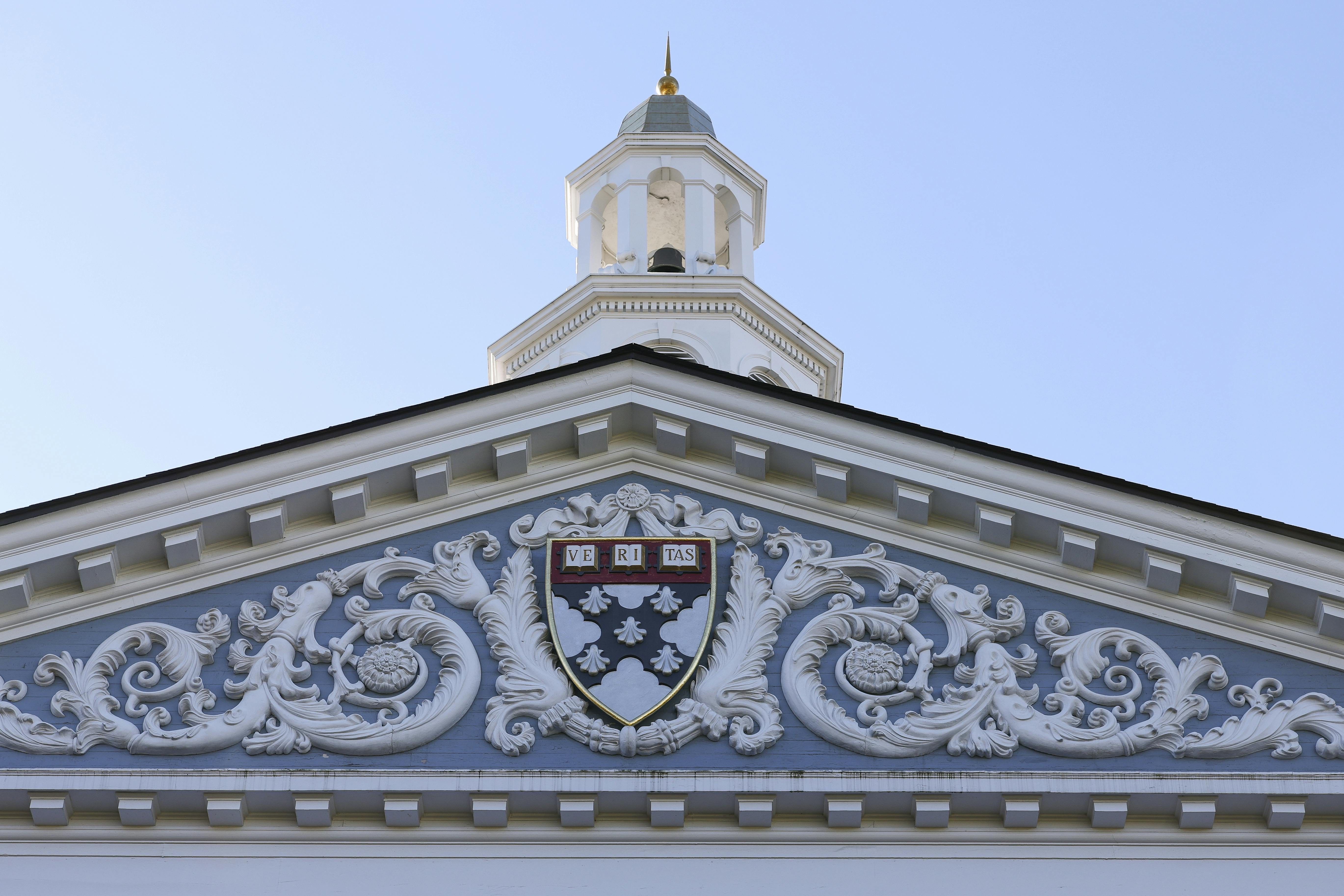 The Harvard crest on the front of the business school building