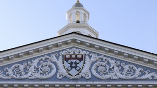 The Harvard crest on the front of the business school building