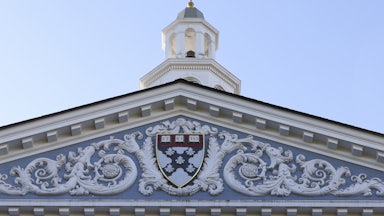 The Harvard crest on the front of the business school building