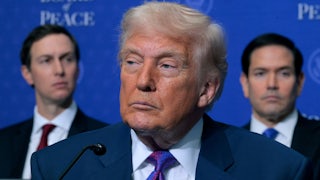 Donald Trump looks to the side, appearing subdued