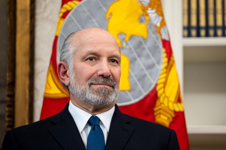 Commerce Secretary Howard Lutnick stands in the Oval Office