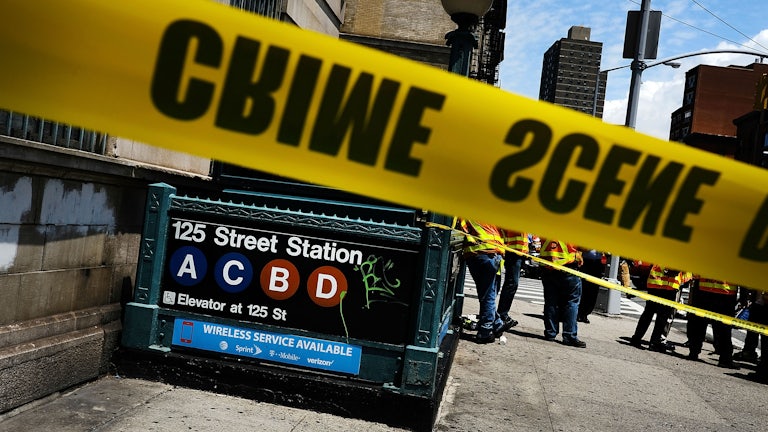 Police tape rings the scene at a subway station in New York City.