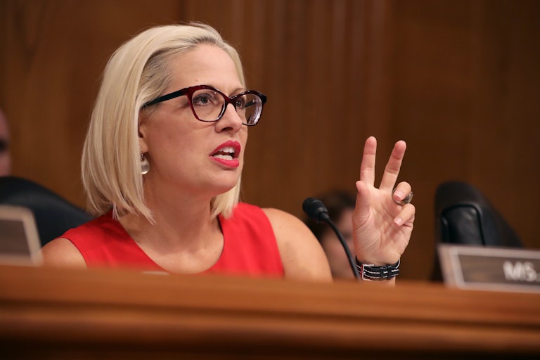 Kyrsten Sinema questions witnesses during a Congressional hearing on Capitol Hill
