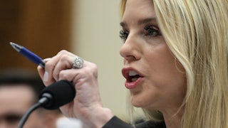 Attorney General Pam Bondi uses a pen to point while speaking during a House hearing