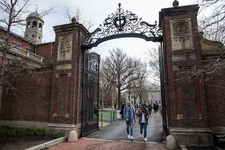 Students walk on Harvard University's campus.