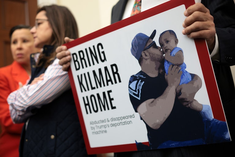 A person holds up a sign that says, "Bring Kilmar home" during a Congressional Hispanic Caucus press conference