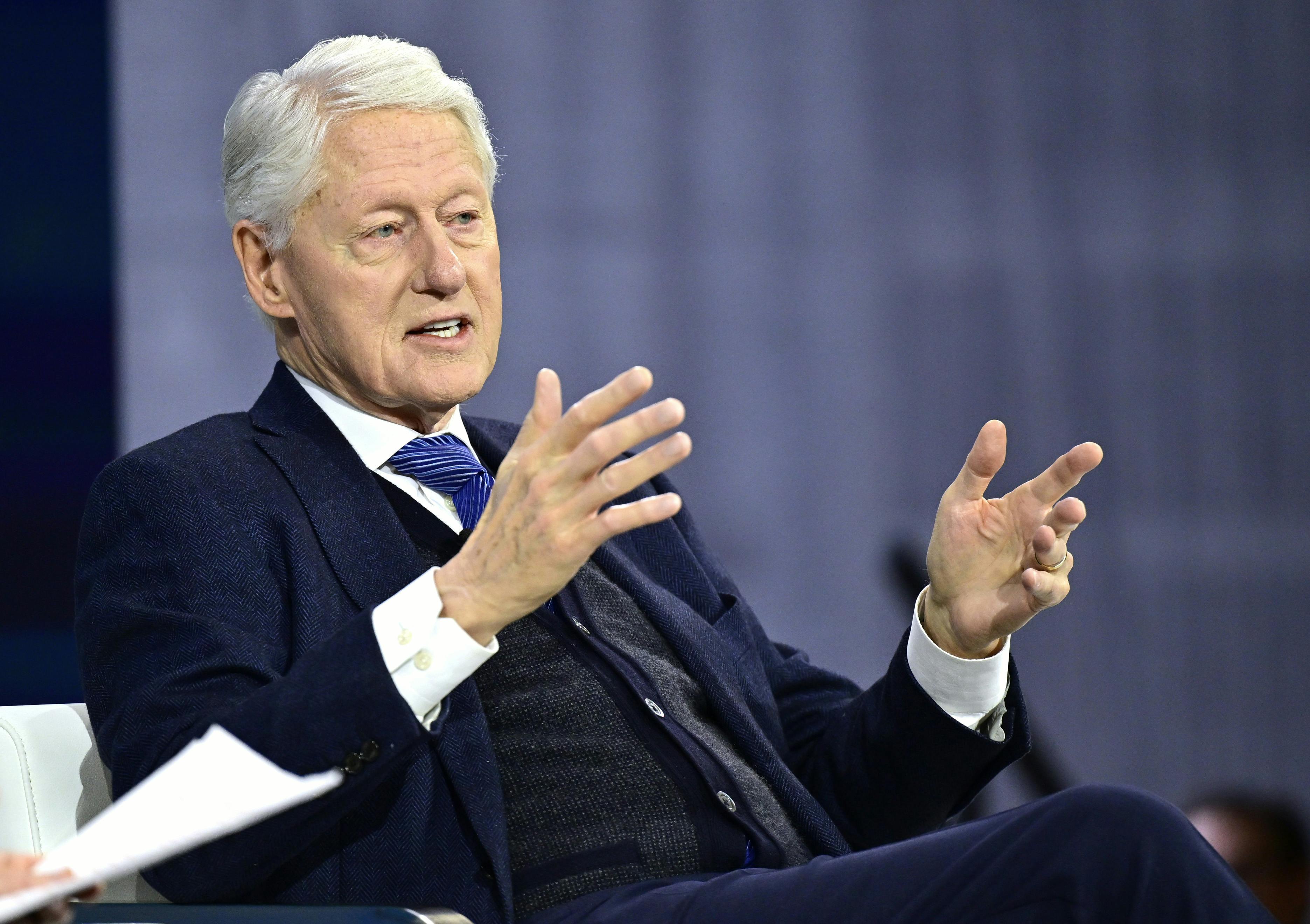 Bill Clinton speaks on a panel.
