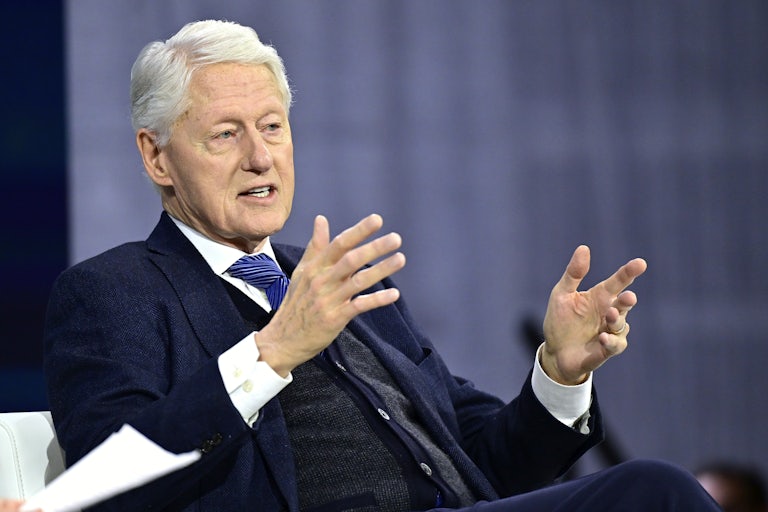 Bill Clinton speaks on a panel.