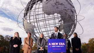 Zohran Mamdani speaks to reporters alongside his transition team, from left, Elana Leopold, Melanie Hartzog,Maria Torres-Springer, Grace Bonilla, and Lina Khan, at Flushing Meadows Corona Park.