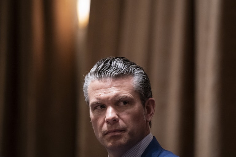 Defense Secretary Pete Hegseth looks to the side while sitting in Donald Trump’s Cabinet meeting at the White House