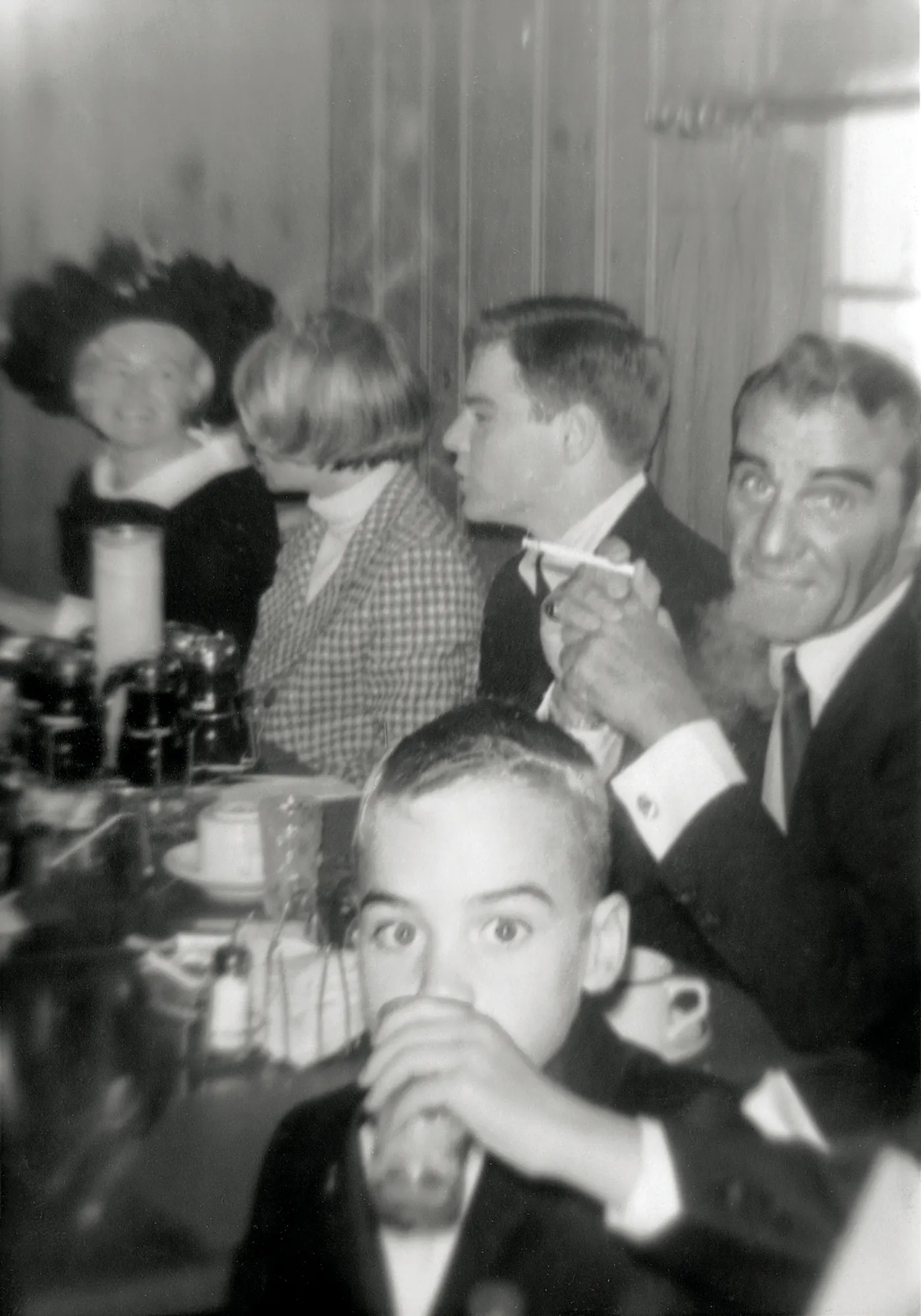A photograph from 1965 of Father and son (right and front) at Tom Junod’s first Communion breakfast.