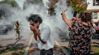 A photo from October 14, federal agents blanketed a neighborhood on the South Side of Chicago in tear gas.