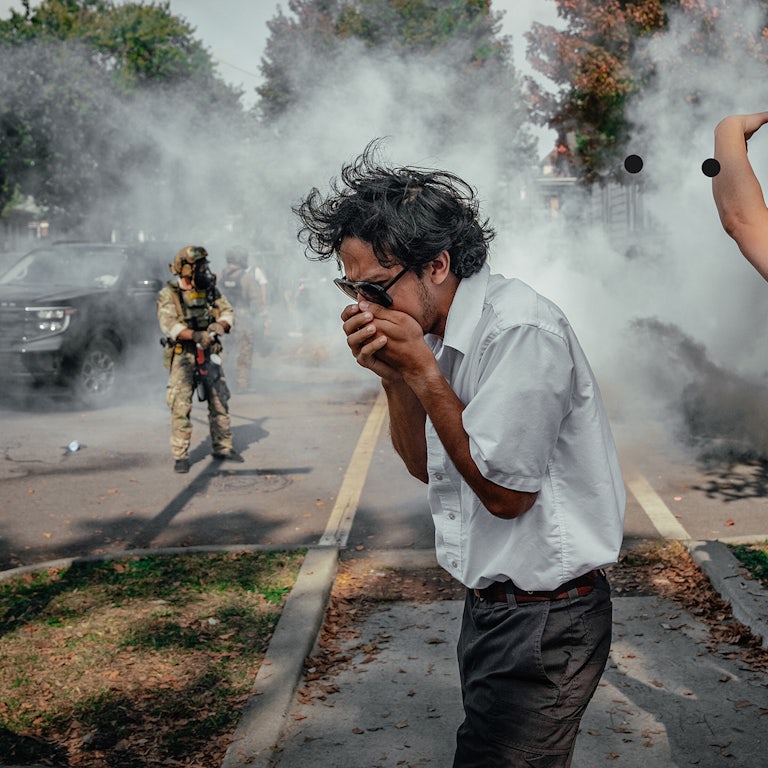 A photo from October 14, federal agents blanketed a neighborhood on the South Side of Chicago in tear gas.