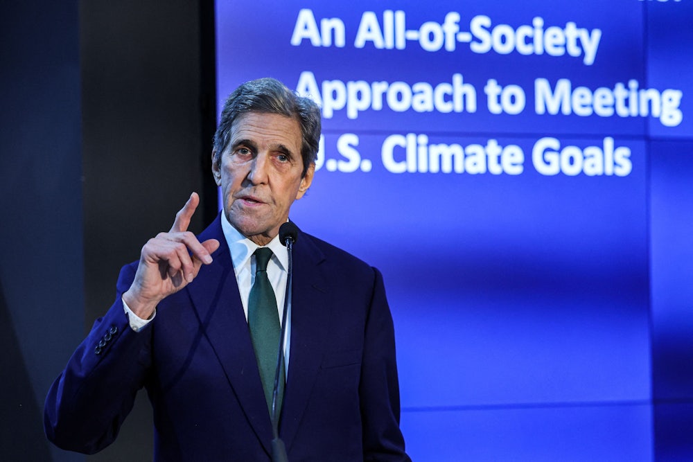 John Kerry holds up a finger while speaking.