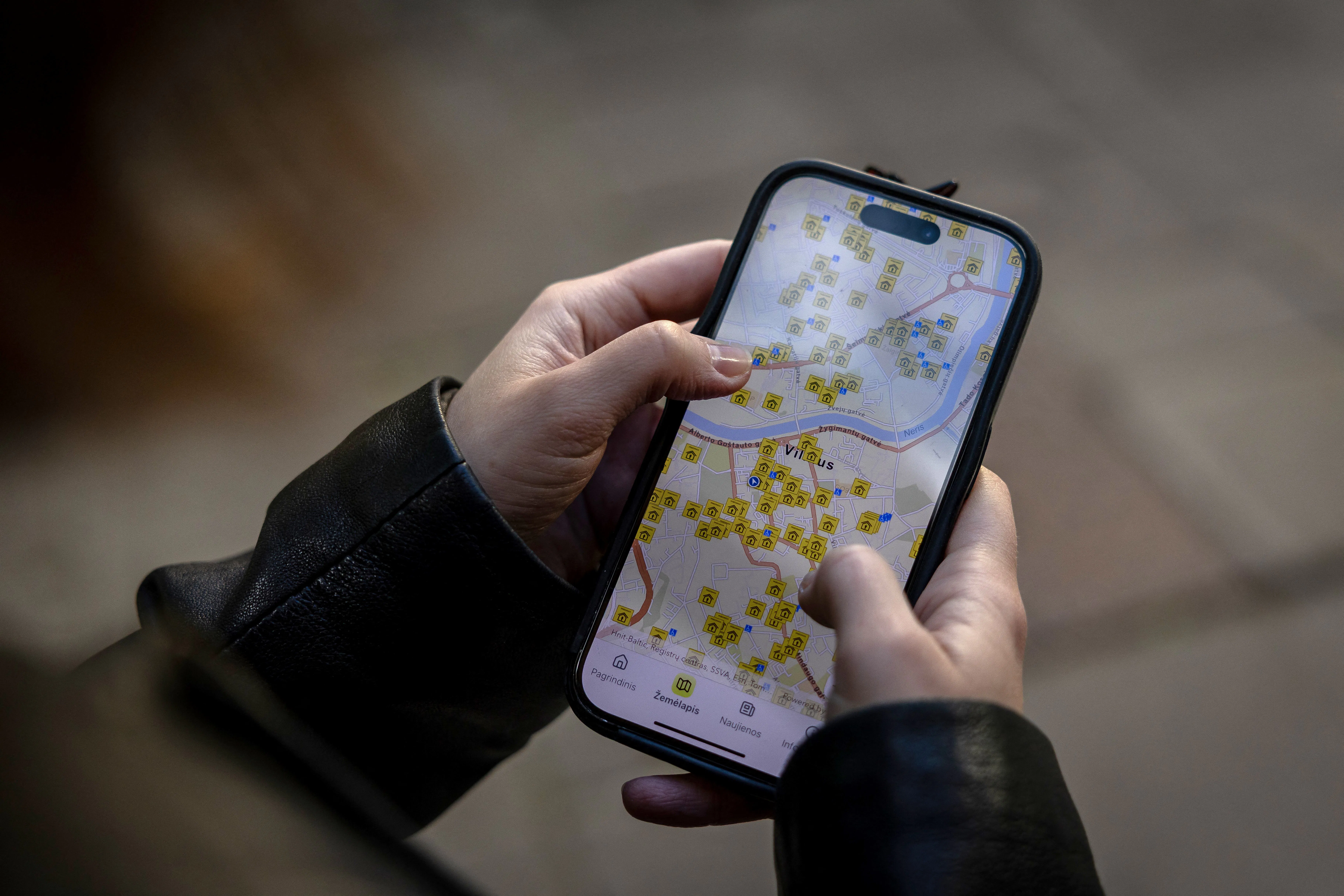 Someone looks at a map on their phone
