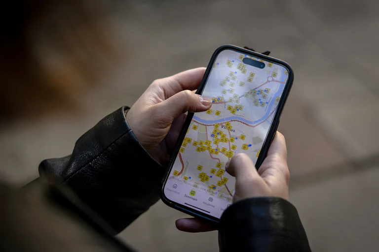 Someone looks at a map on their phone