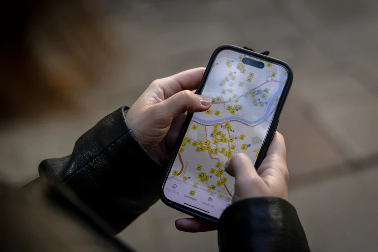 Someone looks at a map on their phone