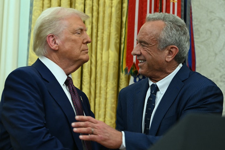Donald Trump and Robert F. Kennedy Jr. shake hands in the Oval Office
