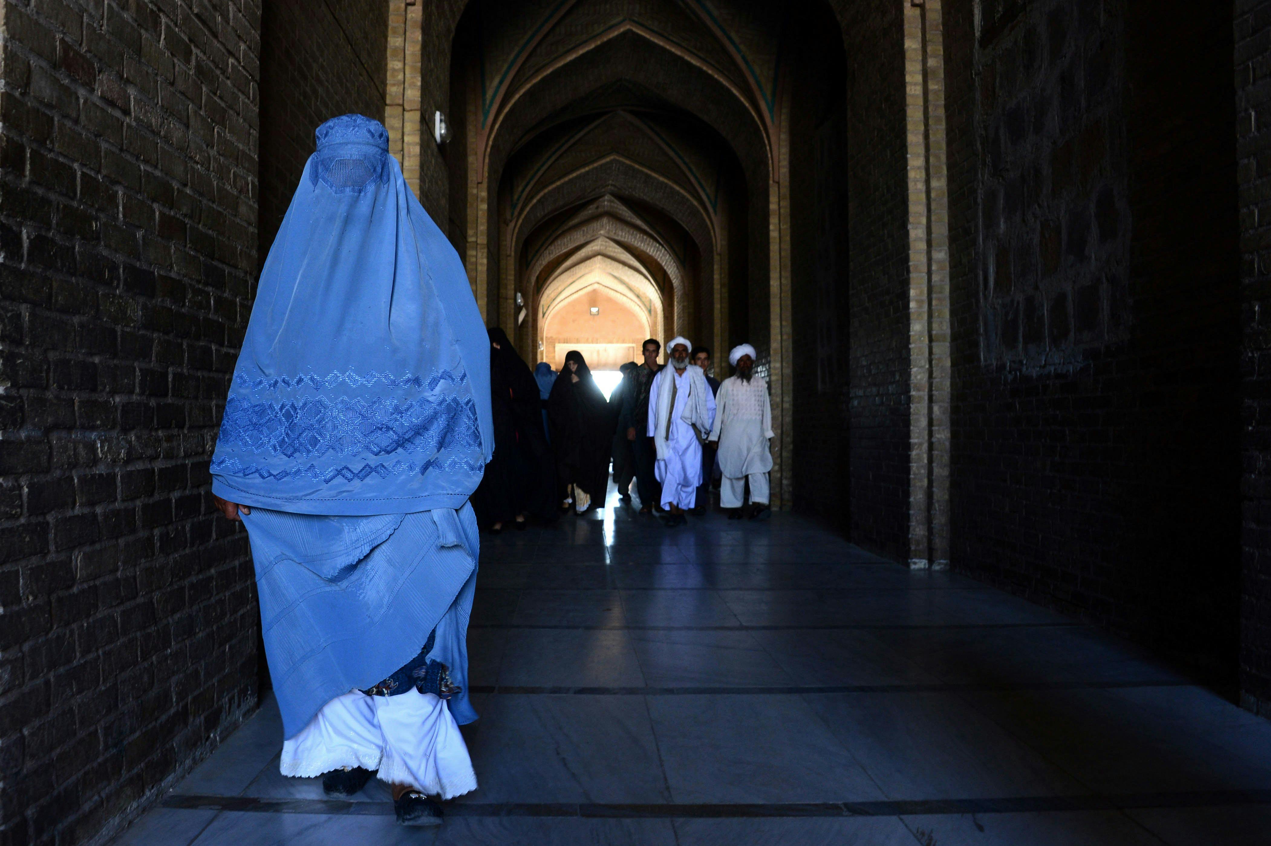 A burqa-clad Afghan woman on her way to offer prayers at the Jami mosque in Herat. 