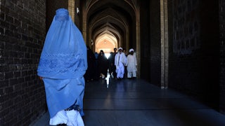 A burqa-clad Afghan woman on her way to offer prayers at the Jami mosque in Herat.