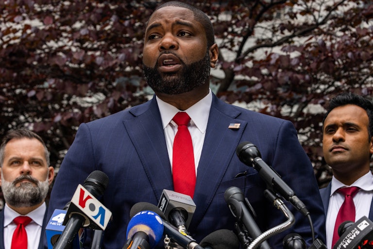 Byron Donalds speaks into microphones