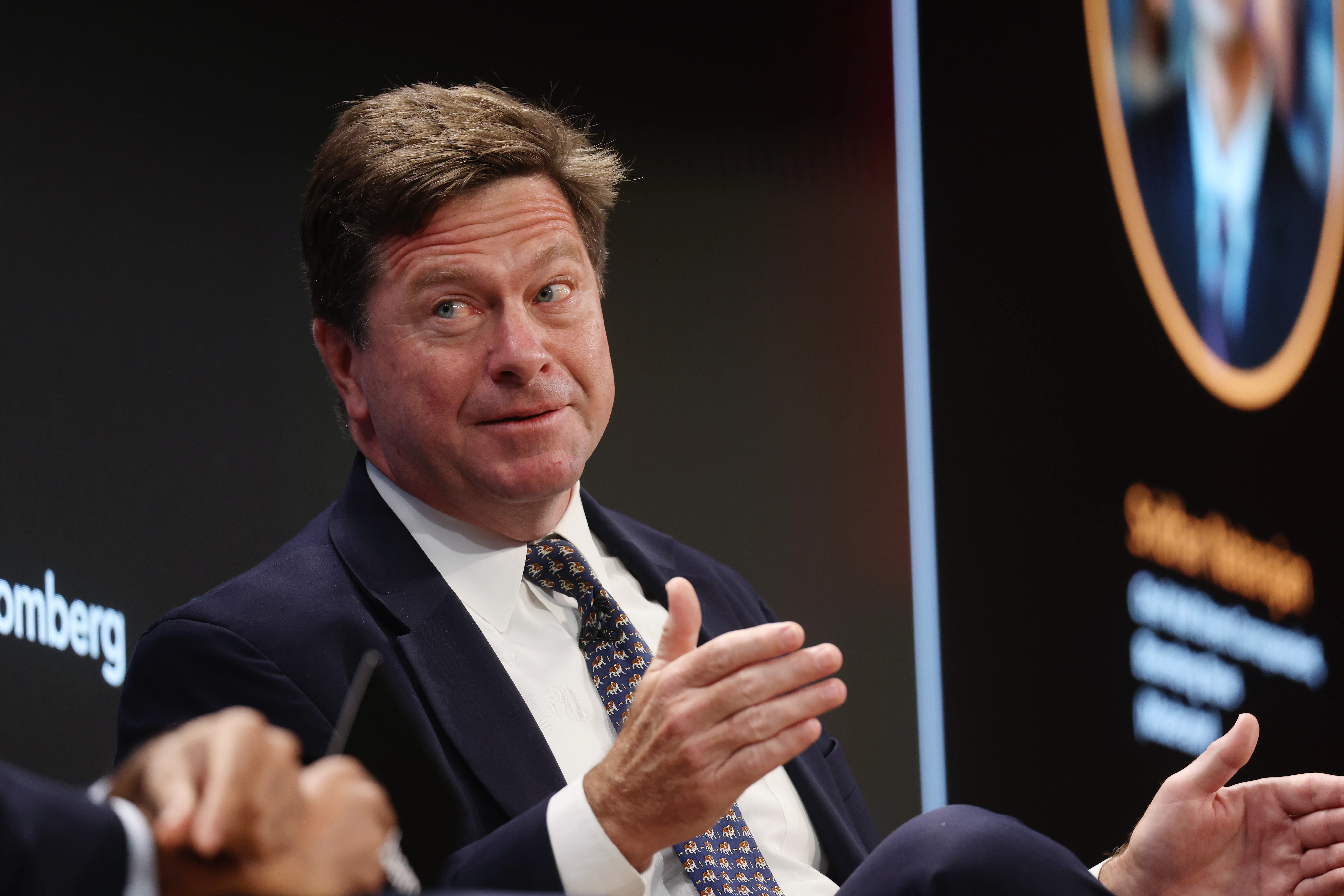 U.S. Attorney for the Southern District of New York Jay Clayton gestures and speaks while sitting on stage during an event
