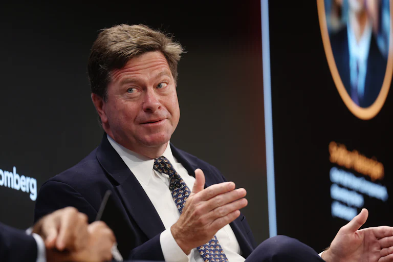 U.S. Attorney for the Southern District of New York Jay Clayton gestures and speaks while sitting on stage during an event