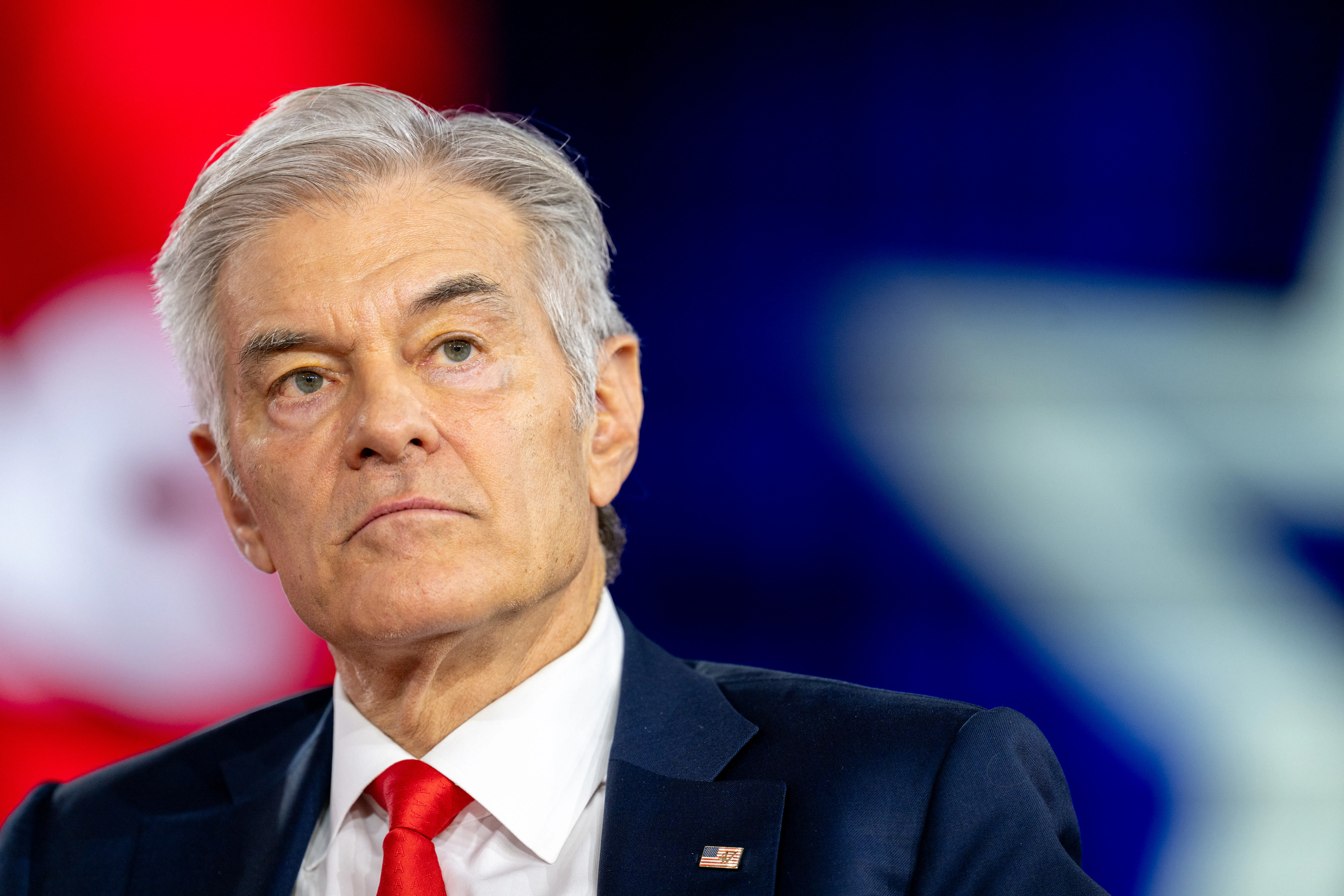 Dr. Mehmet Oz looks up during a CPAC event