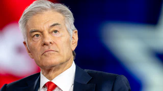 Dr. Mehmet Oz looks up during a CPAC event