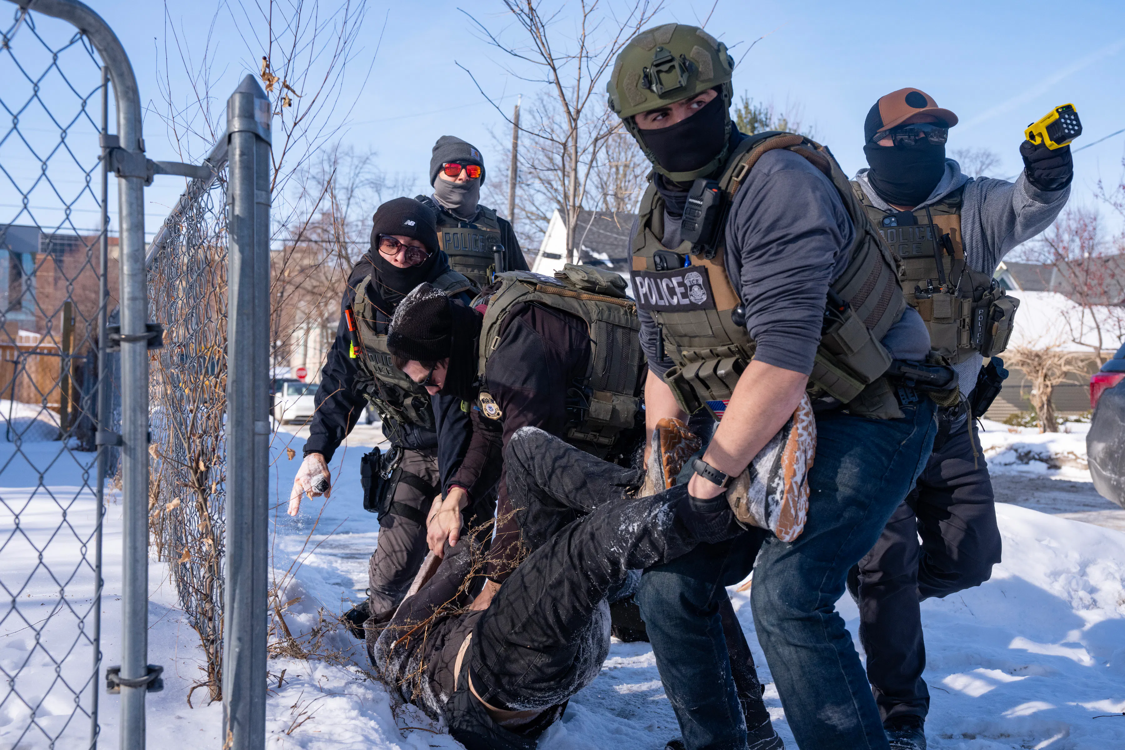 In early February, federal immigration agents in Minneapolis tackled and arrested an ICE protester in the snow.