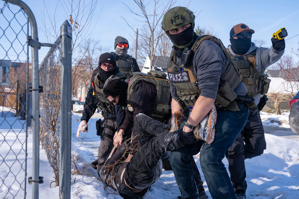 In early February, federal immigration agents in Minneapolis tackled and arrested an ICE protester in the snow.