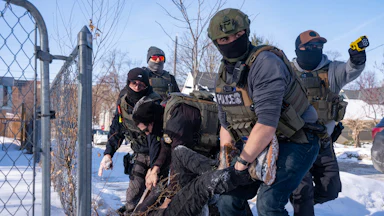 In early February, federal immigration agents in Minneapolis tackled and arrested an ICE protester in the snow.