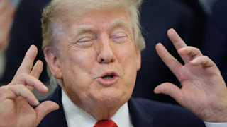 Donald Trump raises hands in gesture with eyes closed
