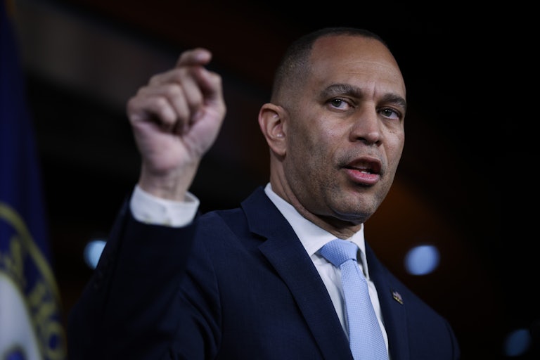 House Minority Leader Hakeem Jeffries speaks and makes a hand gesture for emphasis.