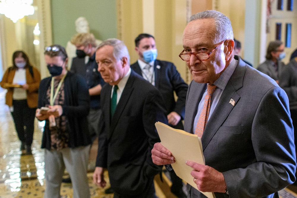 Senate Majority Leader Chuck Schumer and Majority Whip Dick Durbin walk to the Senate Chamber.