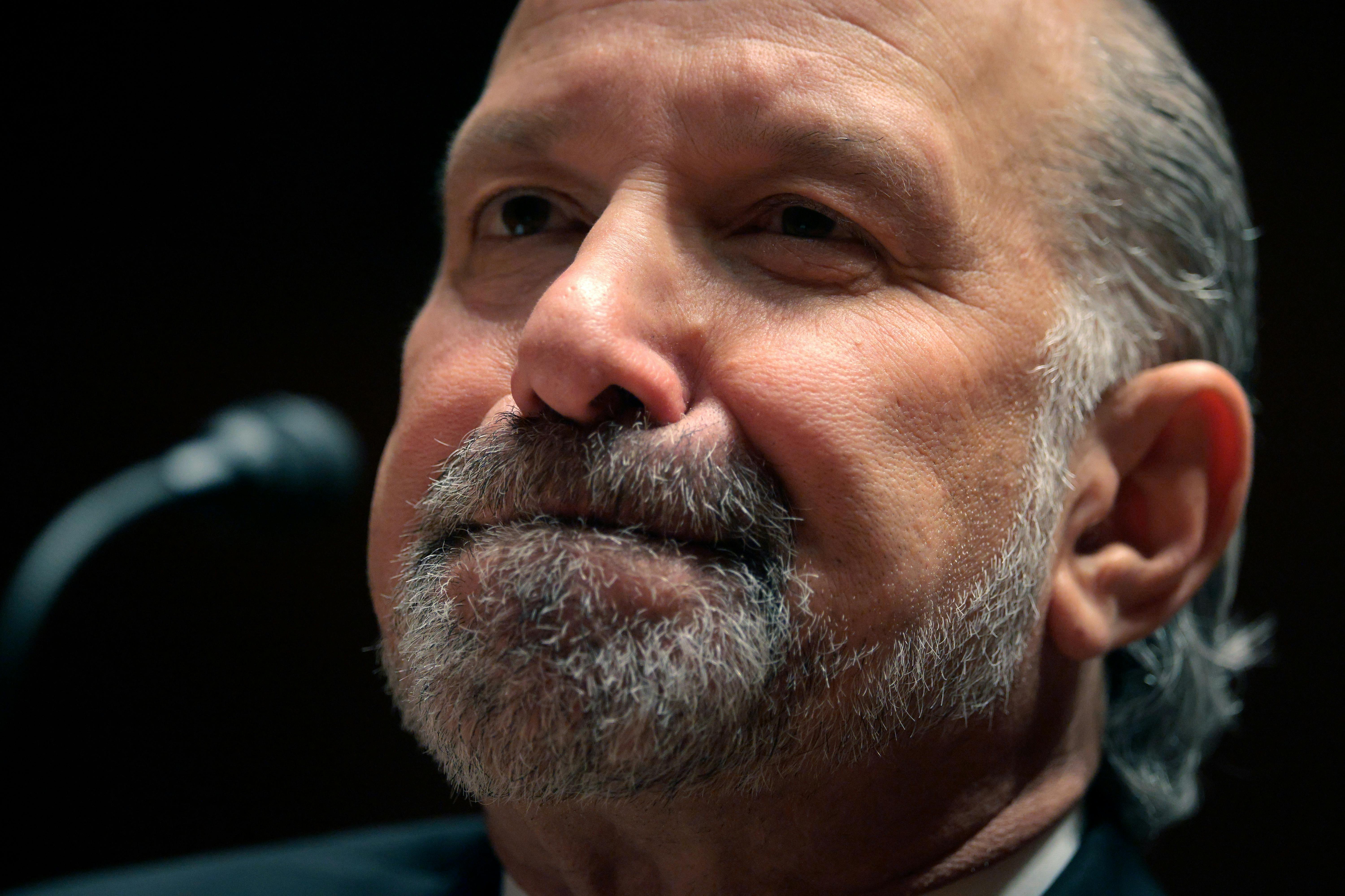 Commerce Secretary Howard Lutnick presses his lips together during a Senate subcommittee hearing