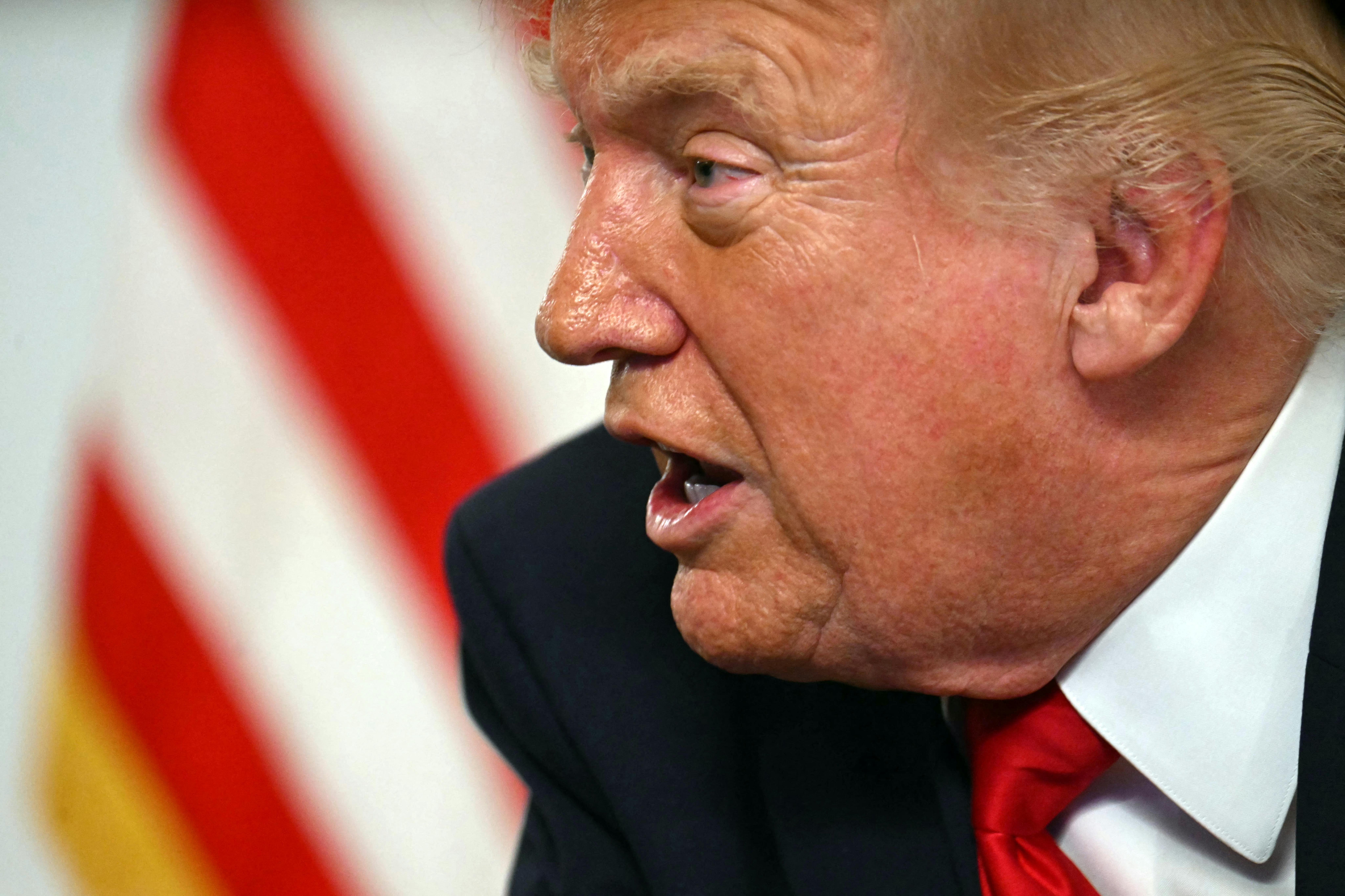 Donald Trump participates in a video call with military service members from his Mar-a-Lago residence in Palm Beach.