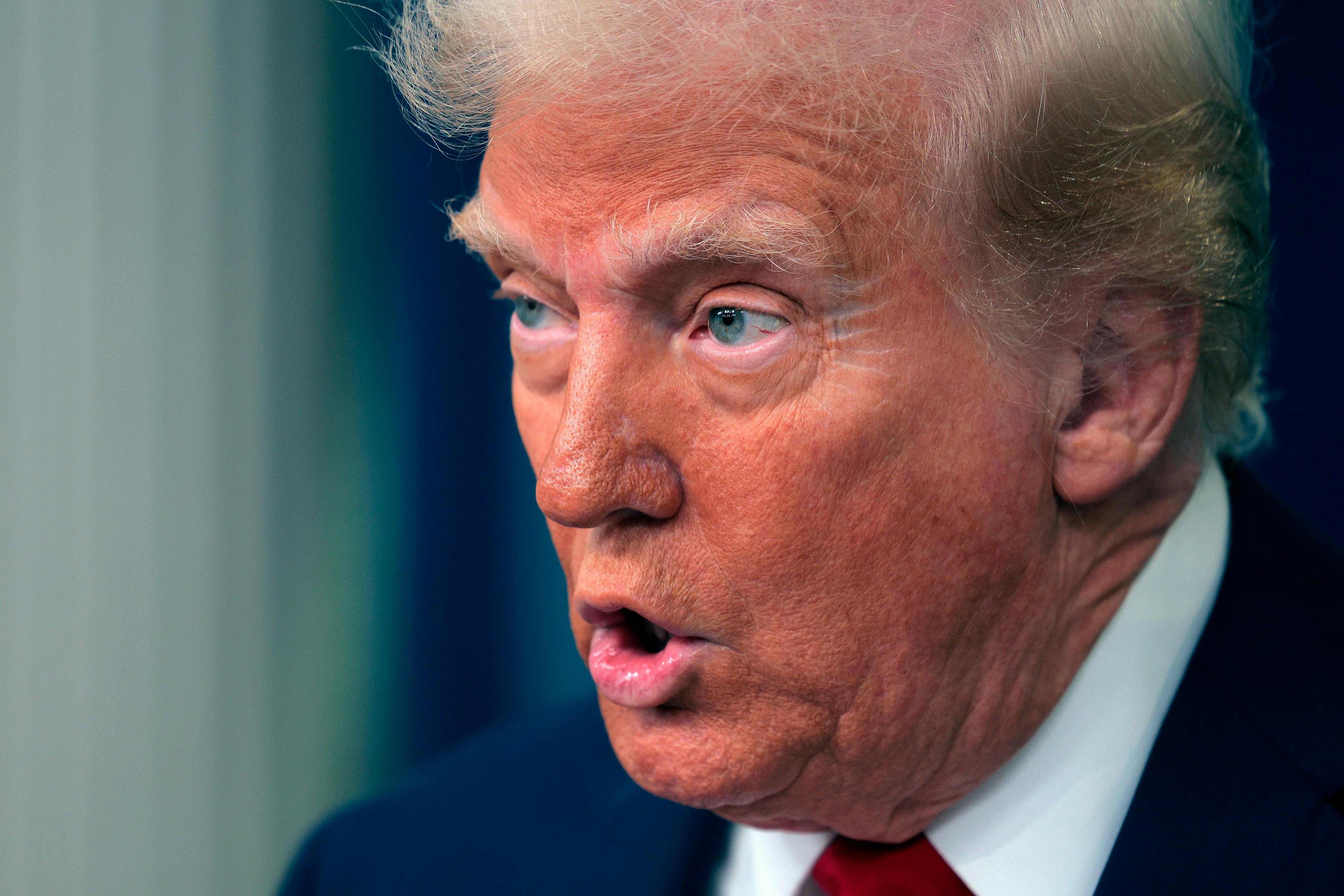 President Donald Trump speaks to reporters in the Brady Press Briefing Room at the White House.