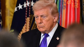 Donald Trump stands during a Medal of Honor ceremony at the White House