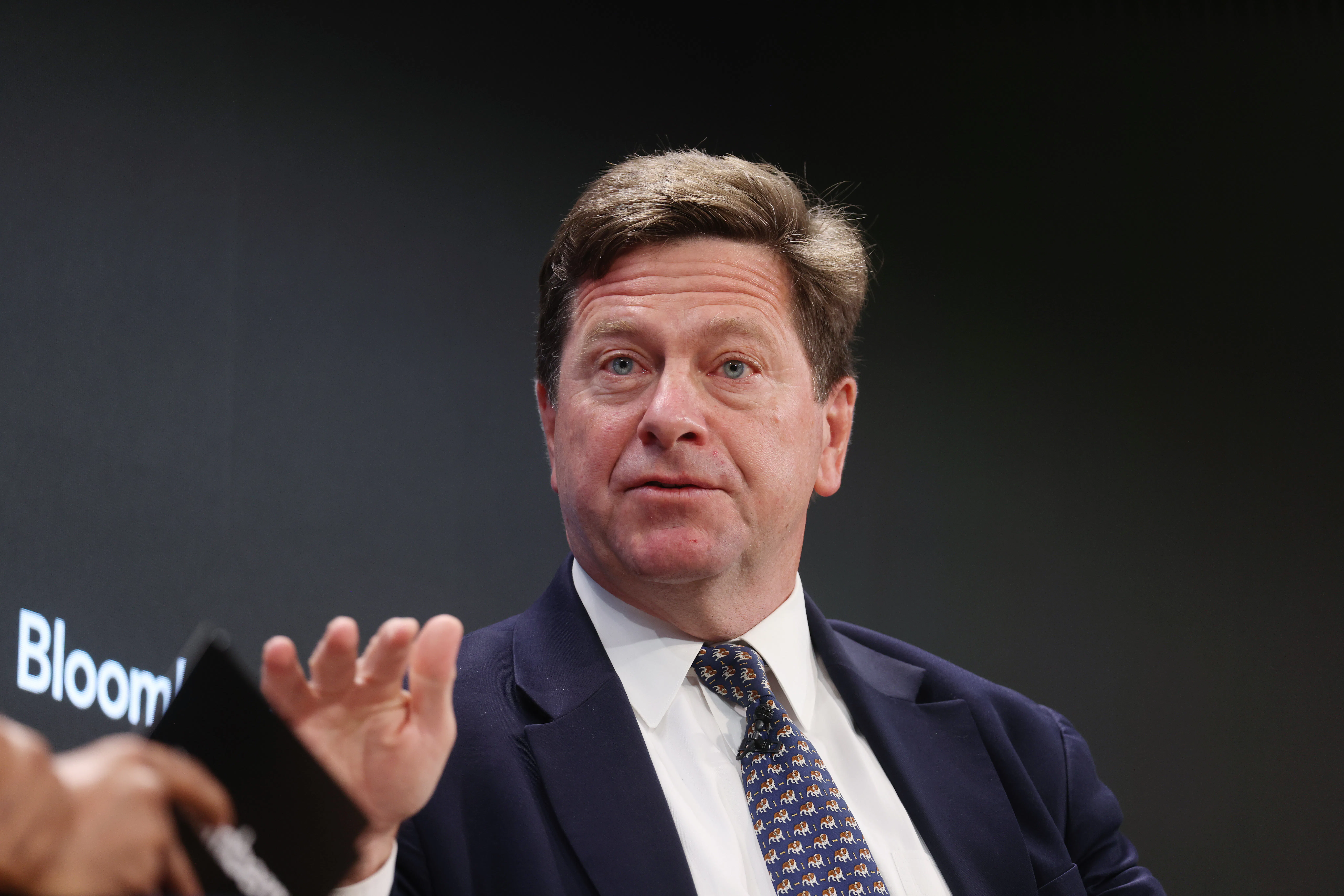 Jay Clayton gestures while speaking during an event
