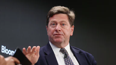 Jay Clayton gestures while speaking during an event