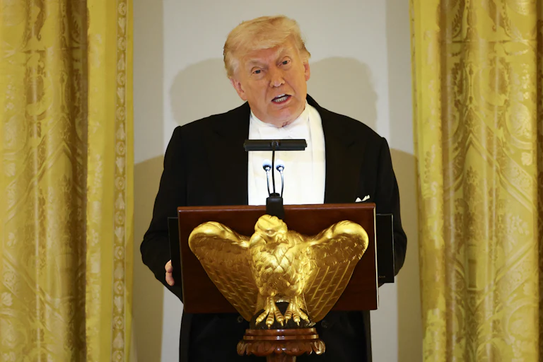 Donald Trump speaks at a podium